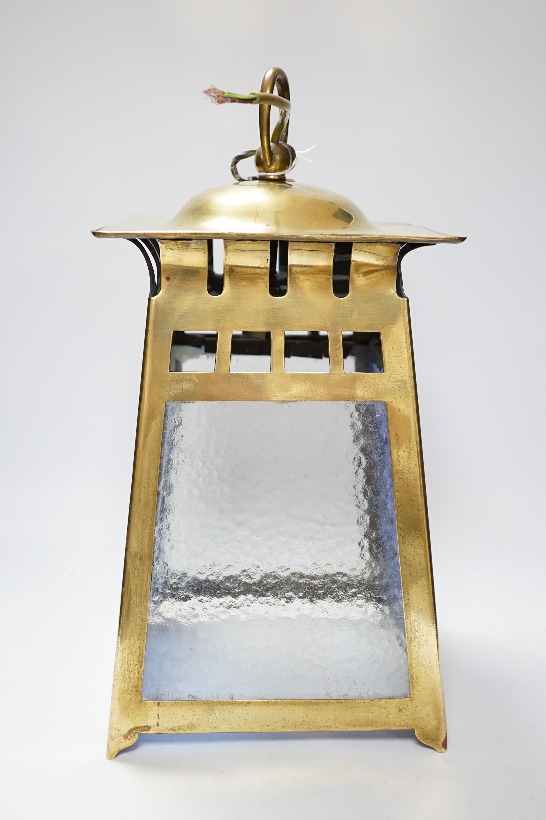 An Arts & Crafts brass and coloured hanging lantern, bought from Liberty’s, 44cm high